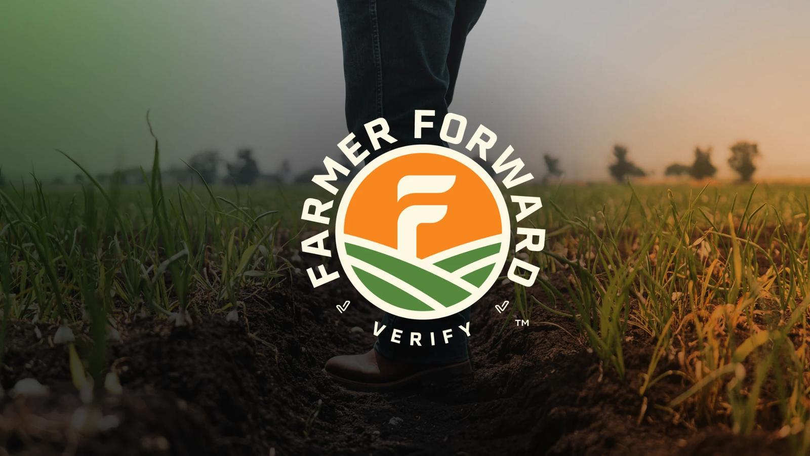 The Farmer Forward Verify seal over a grower standing in a young field